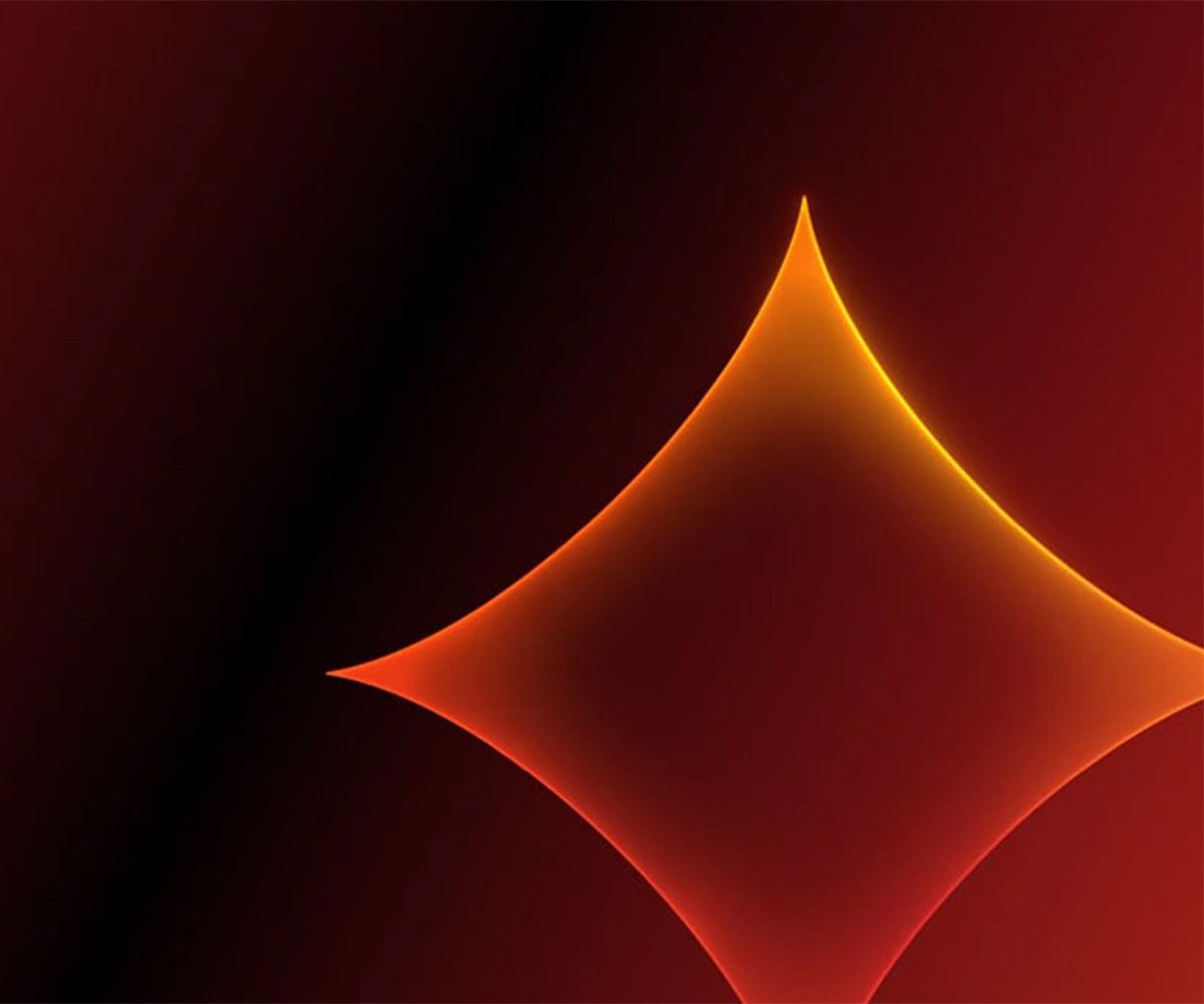 Abstract glowing orange diamond shape on a dark red gradient background