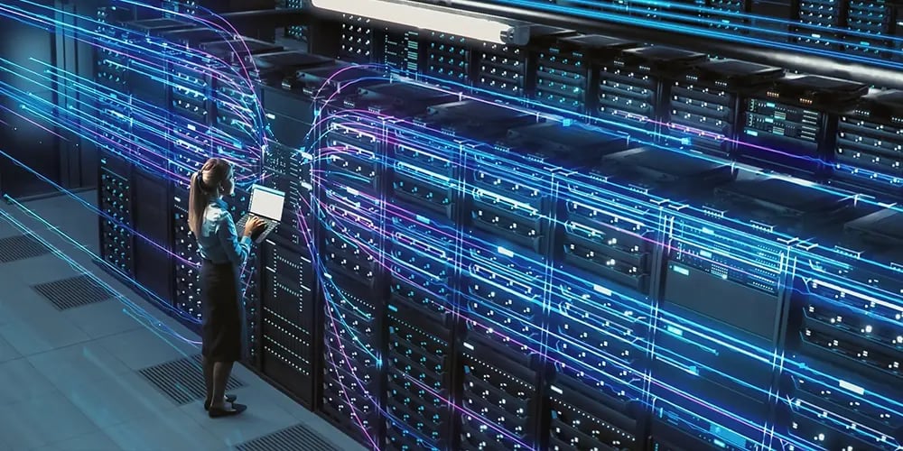 Abstract visualization of data streams flowing from a server rack.