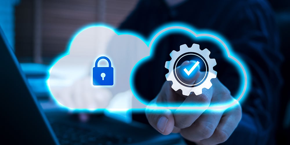 Cloud icons with a lock and check symbol floating above a laptop to represent secure cloud services.