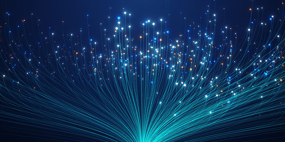 Glowing fibre‑optic style lines and light dots spreading outward.