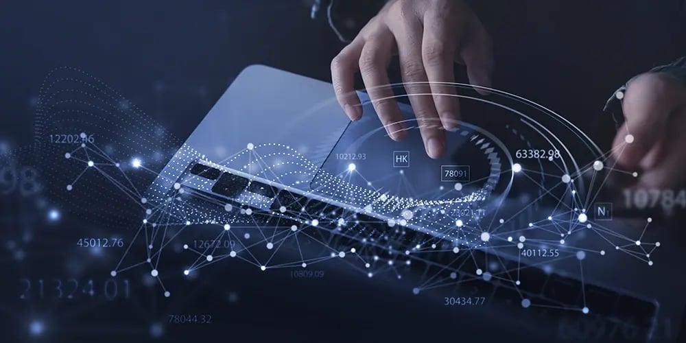 Hands typing on a laptop keyboard overlaid with digital network graphics, numbers, and data points, symbolizing secure data erasure and information protection.