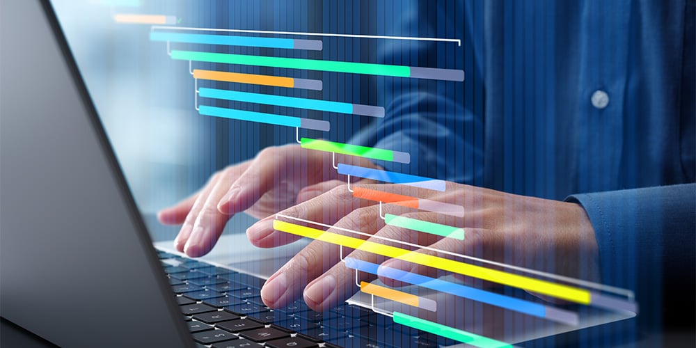 Hands typing on a laptop with colorful horizontal bars overlaid to show software development or project timelines.