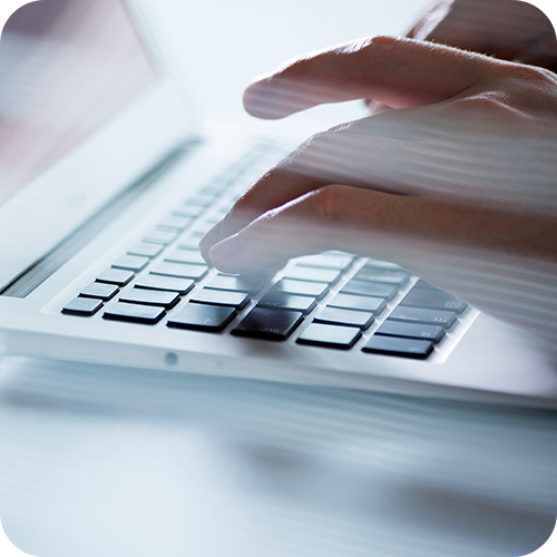 Close up of people working on a laptop