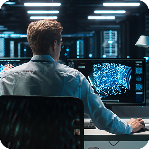 A technician sitting at an IT workstation